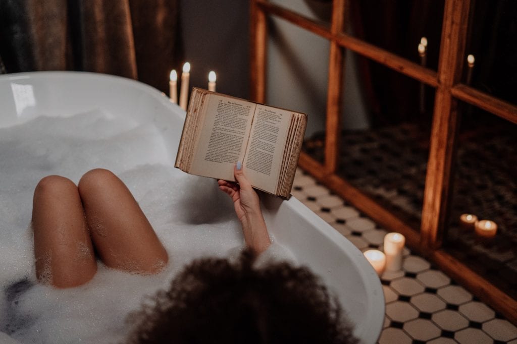 woman reading in bath