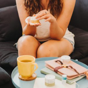 woman using natural hand balm