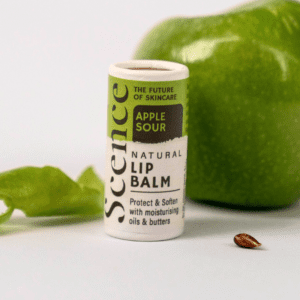 apple sour lip balm in front of green apple