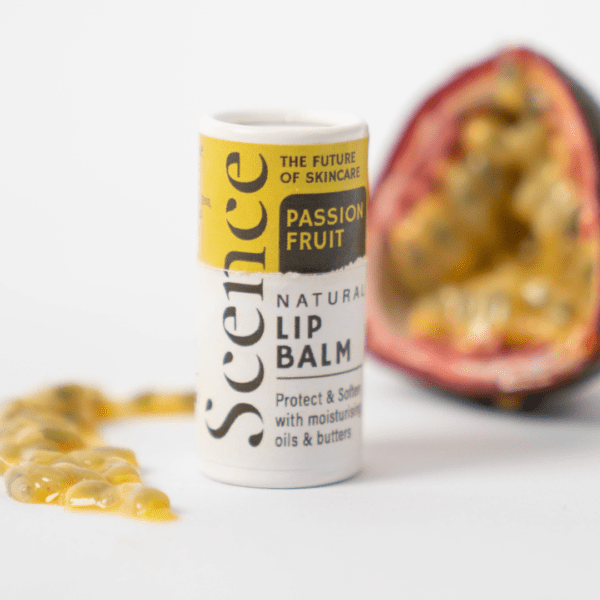 passionfruit lip balm in front of passionfruit