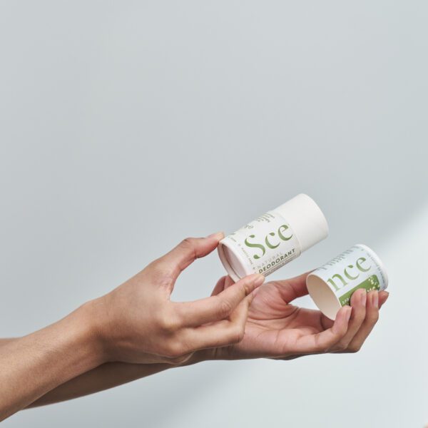 hands holding natural spring blossom deodorant