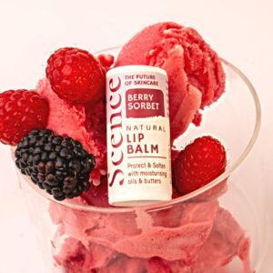 berry sorbet flavoured natural lip balm in glass with sorbet and berries