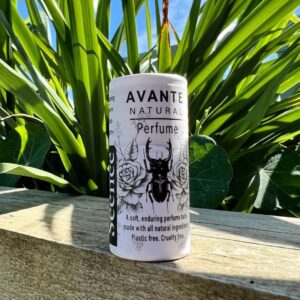 Natural perfume balm in front of plant, avante