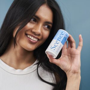 woman holding natural deodorant, lavender mint scent