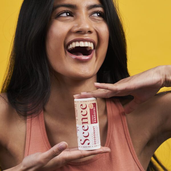 woman holding natural deodorant, citrus paradisi scent